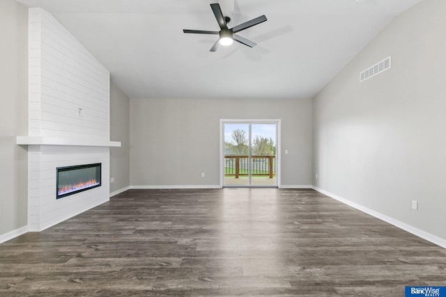 5948 Loxton St, Lincoln, NE 68526 - unfurnished living room with lofted ceiling, a fireplace, a ceiling fan, dark wood finished floors, and baseboards