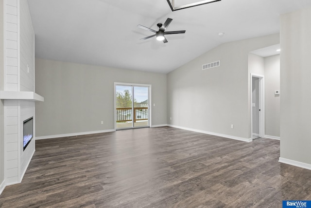 5948 Loxton St, Lincoln, NE 68526 - unfurnished living room featuring a ceiling fan, lofted ceiling, dark wood-style floors, baseboards, and a fireplace