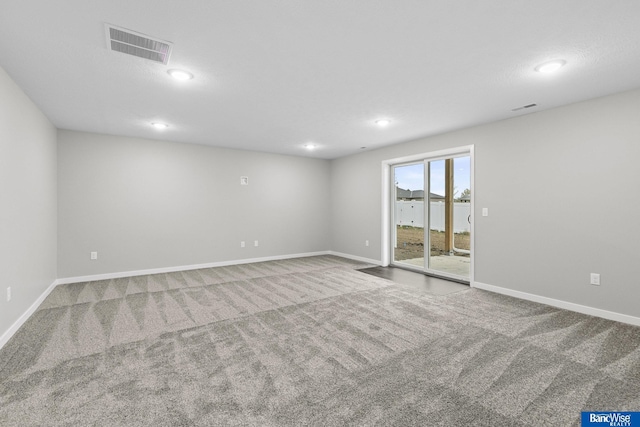 5948 Loxton St, Lincoln, NE 68526 - unfurnished room with carpet floors, baseboards, and recessed lighting