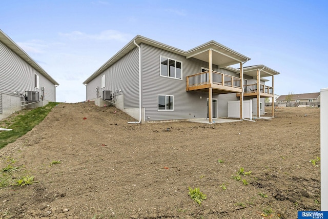 5948 Loxton St, Lincoln, NE 68526 - rear view of property with central AC unit and a balcony