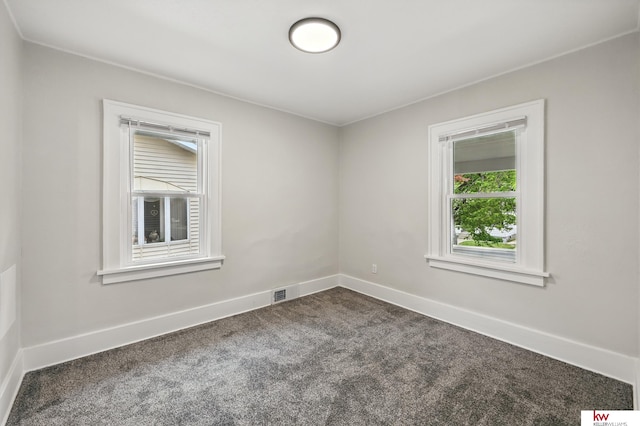 2740 N 49th St, Omaha, NE 68104 - empty room featuring dark carpet and baseboards