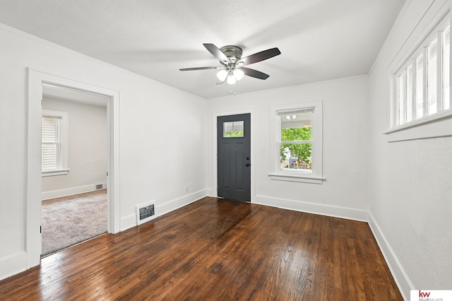2740 N 49th St, Omaha, NE 68104 - entrance foyer featuring a ceiling fan, dark wood finished floors, baseboards, and ornamental molding