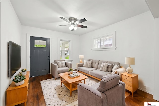 2740 N 49th St, Omaha, NE 68104 - living room with wood finished floors, a ceiling fan, and baseboards