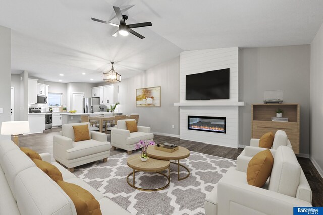 5956 Loxton St, Lincoln, NE 68526 - living room featuring wood finished floors, ceiling fan, baseboards, recessed lighting, and a fireplace