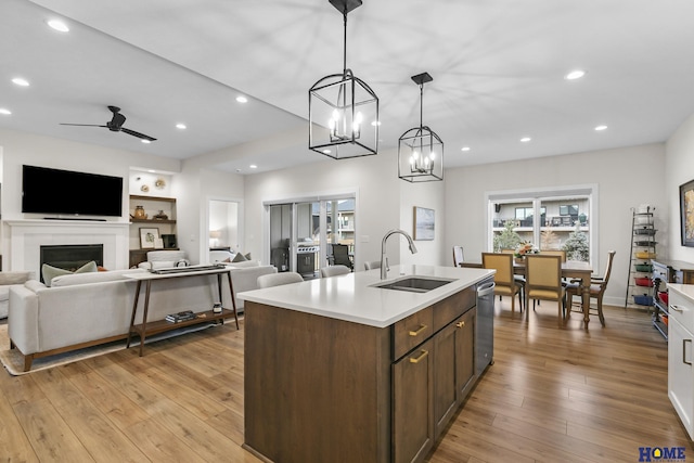 9750 Casa Galeano Ct, Lincoln, NE 68520 - kitchen with a sink, dishwasher, light countertops, a center island with sink, and recessed lighting
