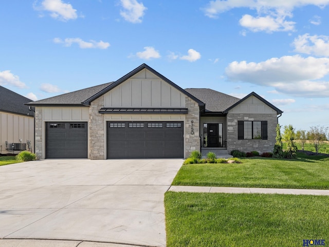 9750 Casa Galeano Ct, Lincoln, NE 68520 - view of front of home featuring an attached garage, driveway, a front yard, board and batten siding, and a shingled roof