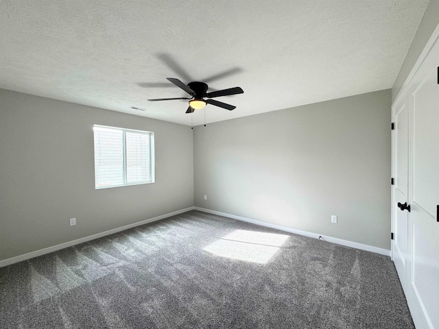 9434 Duckhorn Dr, Lincoln, NE 68526 - unfurnished room featuring carpet flooring, ceiling fan, baseboards, and a textured ceiling