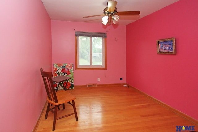 6810 S St S, Lincoln, NE 68506 - sitting room with light wood-style flooring, a ceiling fan, and baseboards