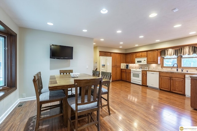 10919 N 69th St, Omaha, NE 68152 - dining area with light wood finished floors, plenty of natural light, recessed lighting, and baseboards