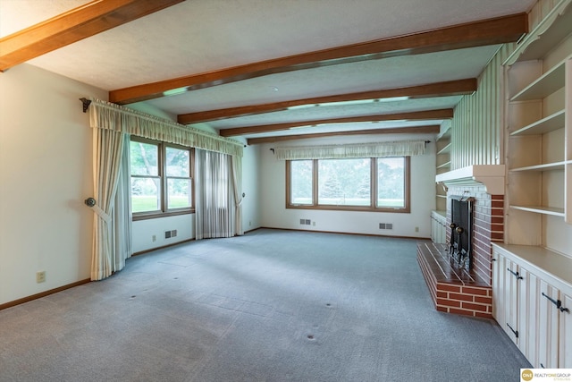 10919 N 69th St, Omaha, NE 68152 - unfurnished living room featuring light colored carpet, a fireplace, beam ceiling, and baseboards