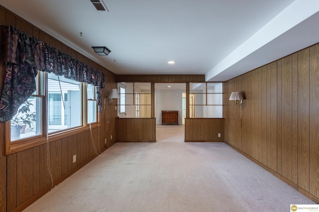 10919 N 69th St, Omaha, NE 68152 - empty room with wooden walls and light carpet