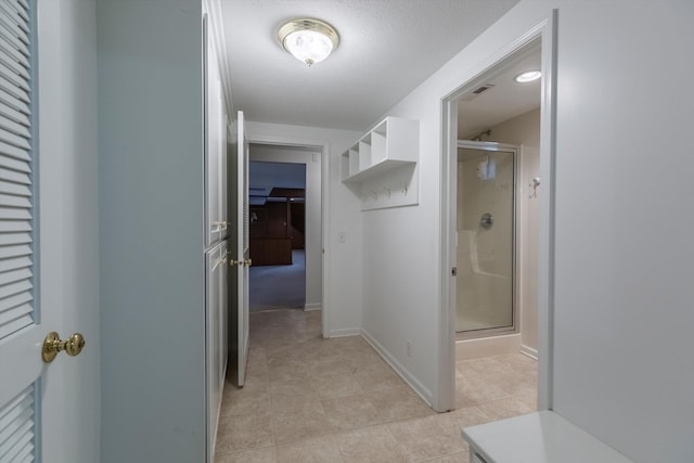 10919 N 69th St, Omaha, NE 68152 - hall featuring light tile patterned floors and baseboards