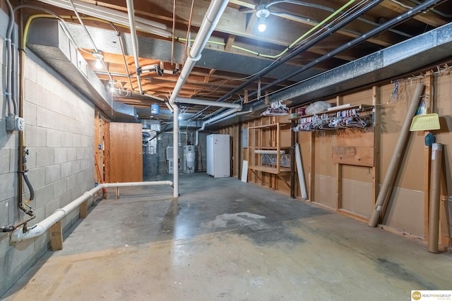 10919 N 69th St, Omaha, NE 68152 - unfinished basement with fridge and concrete block wall