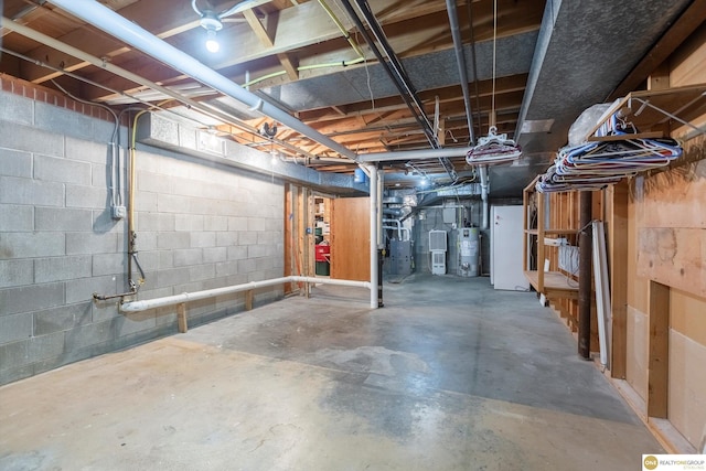 10919 N 69th St, Omaha, NE 68152 - unfinished basement featuring gas water heater and concrete block wall
