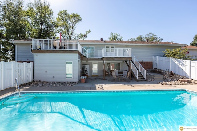 10919 N 69th St, Omaha, NE 68152 - back of house with stairway, a fenced backyard, a patio, a wooden deck, and a gate