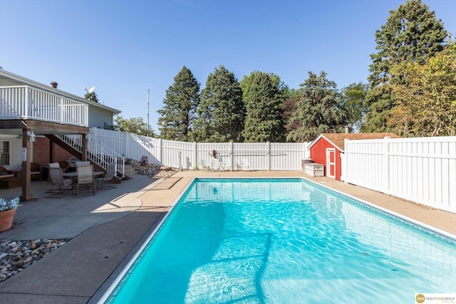 10919 N 69th St, Omaha, NE 68152 - view of pool with a fenced backyard, stairs, a patio area, and a deck