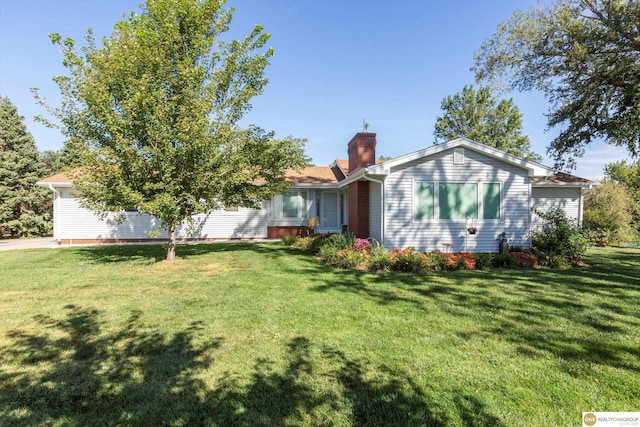10919 N 69th St, Omaha, NE 68152 - view of front facade with a chimney and a front yard