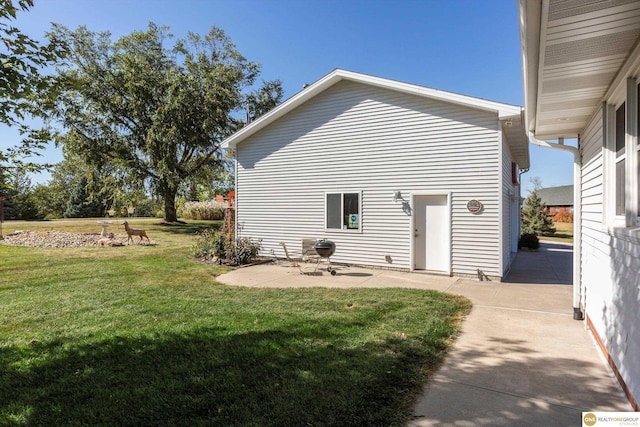 10919 N 69th St, Omaha, NE 68152 - back of property with a patio and a lawn