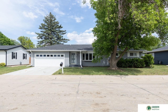 6 N Circle Dr, York, NE 68467 - ranch-style home with a garage, concrete driveway, and a front yard