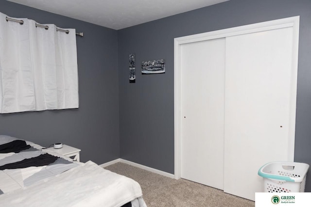 6 N Circle Dr, York, NE 68467 - bedroom with carpet flooring, a closet, and baseboards