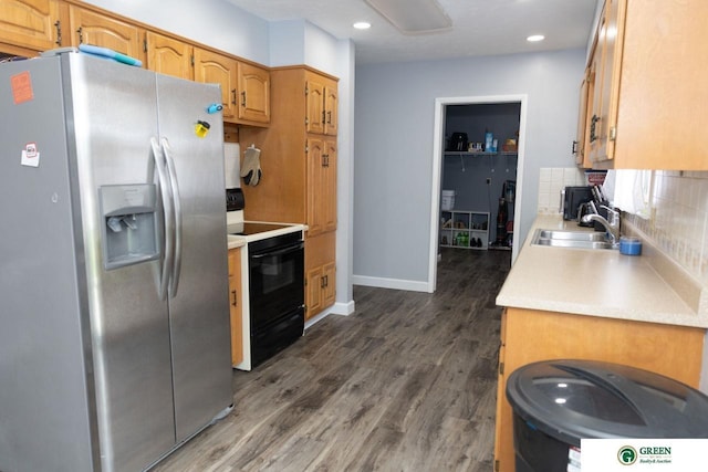 6 N Circle Dr, York, NE 68467 - kitchen with stainless steel refrigerator with ice dispenser, black electric range oven, a sink, decorative backsplash, and light countertops