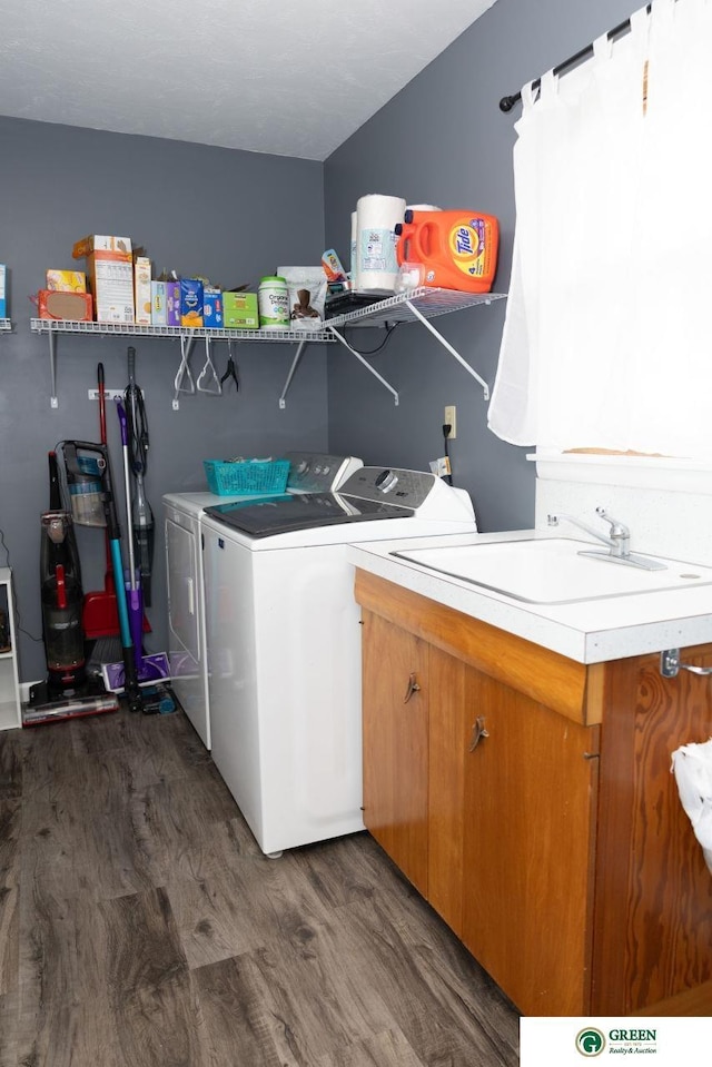 6 N Circle Dr, York, NE 68467 - washroom with cabinet space, washer and clothes dryer, and dark wood-type flooring