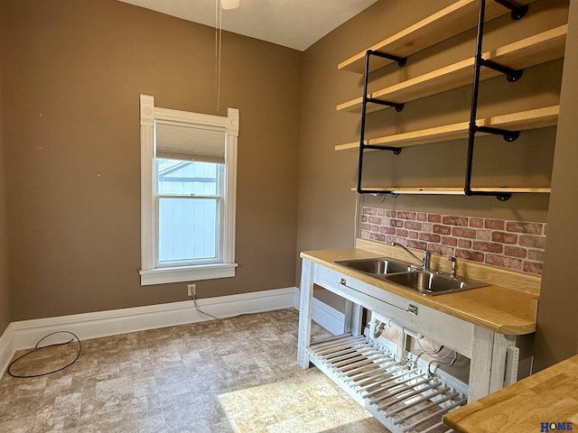 339 S Columbia Ave, Seward, NE 68434 - kitchen with a sink, baseboards, and open shelves