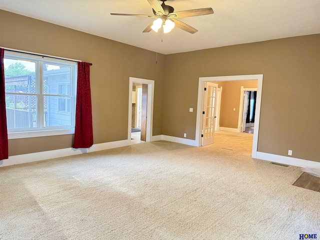 339 S Columbia Ave, Seward, NE 68434 - empty room with ceiling fan, light carpet, and baseboards