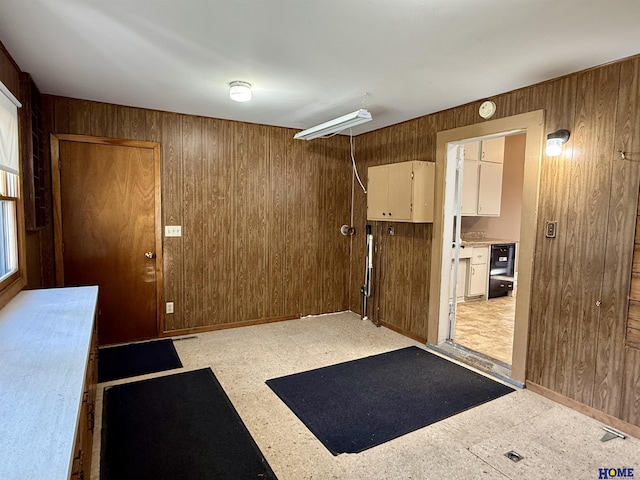 339 S Columbia Ave, Seward, NE 68434 - miscellaneous room with wooden walls and light floors
