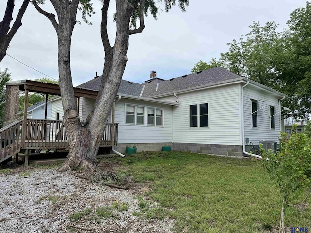 339 S Columbia Ave, Seward, NE 68434 - back of house featuring a yard, a shingled roof, and a wooden deck