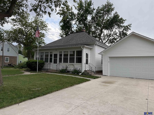 339 S Columbia Ave, Seward, NE 68434 - view of front of home featuring entry steps, roof with shingles, a front lawn, and a chimney