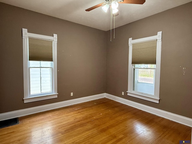 339 S Columbia Ave, Seward, NE 68434 - empty room featuring wood-type flooring, baseboards, and a ceiling fan
