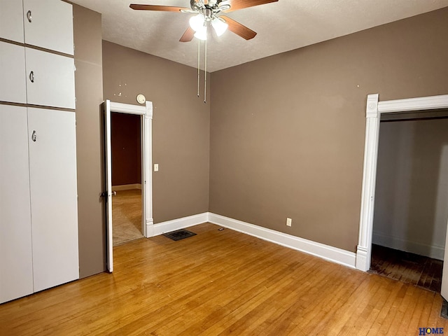 339 S Columbia Ave, Seward, NE 68434 - unfurnished bedroom featuring light wood finished floors, baseboards, and a ceiling fan