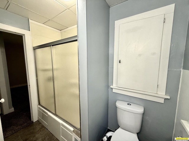 518 N 18th St, Nebraska City, NE 68410 - full bath featuring a drop ceiling, toilet, and shower / bath combination with glass door