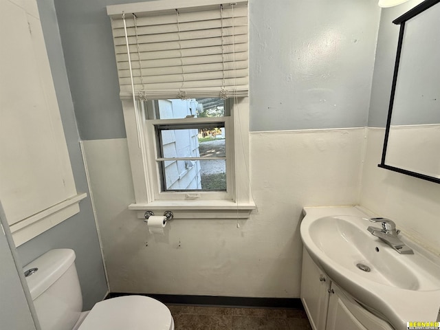 518 N 18th St, Nebraska City, NE 68410 - half bathroom featuring toilet, vanity, and baseboards