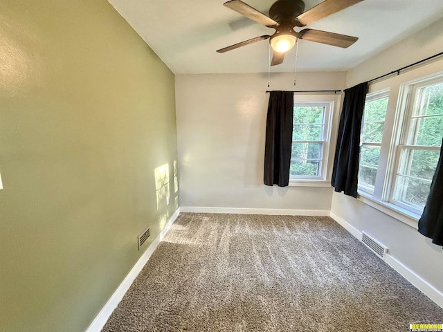 518 N 18th St, Nebraska City, NE 68410 - unfurnished room with baseboards, a ceiling fan, carpet flooring, and plenty of natural light