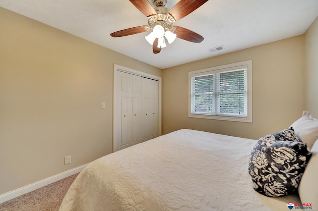 6609 Shenandoah Ct, Lincoln, NE 68510 - carpeted bedroom with baseboards, a closet, and a ceiling fan