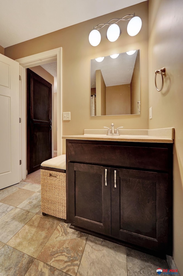 6609 Shenandoah Ct, Lincoln, NE 68510 - bathroom featuring vanity and stone finish floors