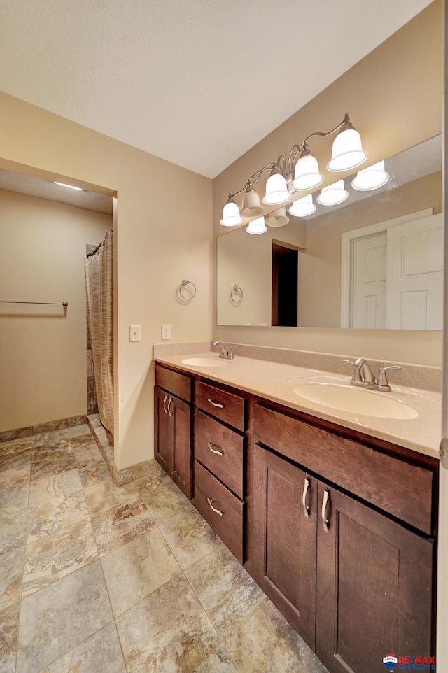 6609 Shenandoah Ct, Lincoln, NE 68510 - full bathroom featuring double vanity, baseboards, and curtained shower