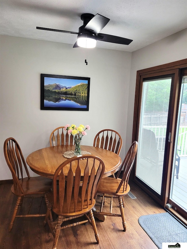 5201 Danbury Ct, Lincoln, NE 68512 - dining area featuring wood finished floors, a ceiling fan, and baseboards