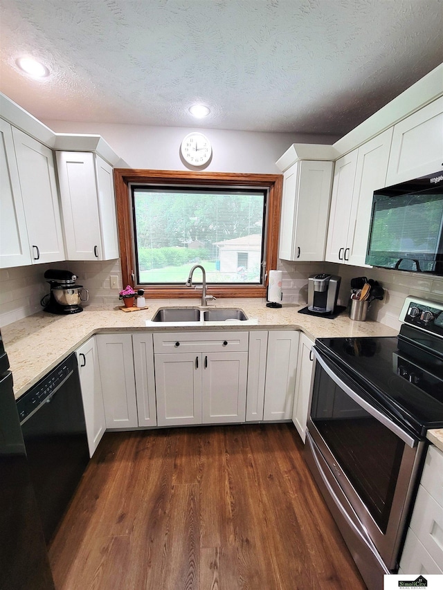 5201 Danbury Ct, Lincoln, NE 68512 - kitchen featuring a sink, black appliances, white cabinetry, dark wood-style flooring, and backsplash