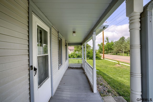 165 Monroe St, Bennet, NE 68317 - wooden porch featuring a yard