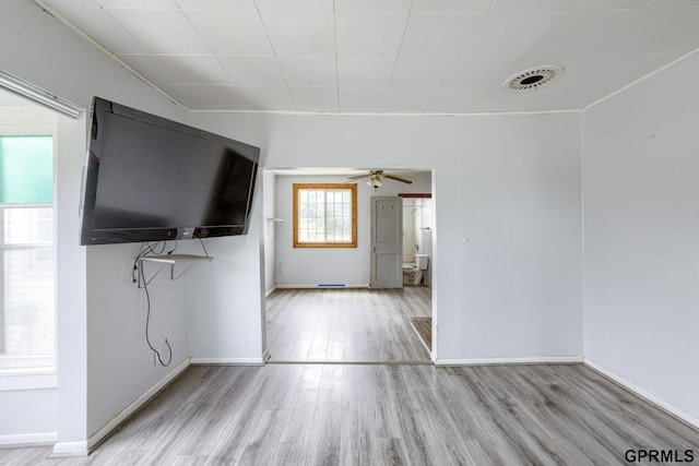 165 Monroe St, Bennet, NE 68317 - unfurnished living room featuring wood finished floors, ceiling fan, and baseboards
