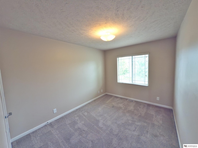 5306 S 195th St, Omaha, NE 68135 - carpeted spare room with baseboards and a textured ceiling