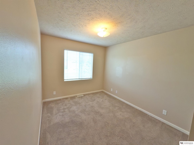 5306 S 195th St, Omaha, NE 68135 - unfurnished room featuring a textured ceiling, baseboards, and carpet floors