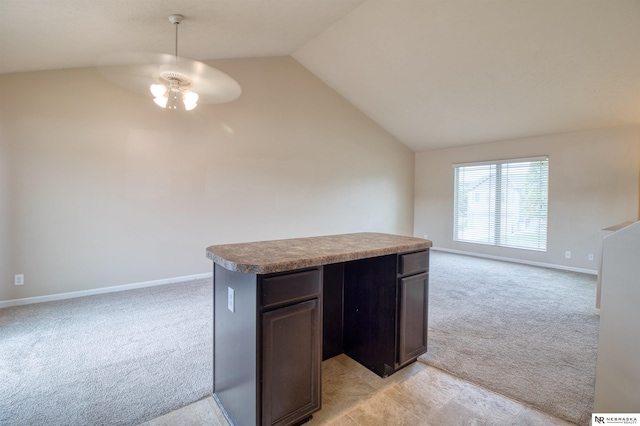 5306 S 195th St, Omaha, NE 68135 - kitchen featuring ceiling fan, light carpet, lofted ceiling, open floor plan, and baseboards