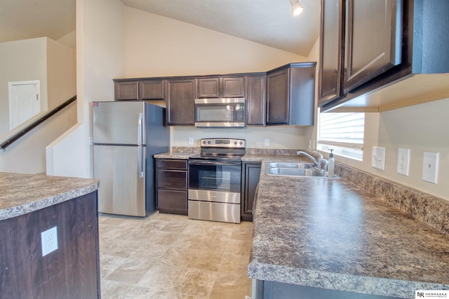 5306 S 195th St, Omaha, NE 68135 - kitchen with appliances with stainless steel finishes, a sink, dark brown cabinetry, and vaulted ceiling