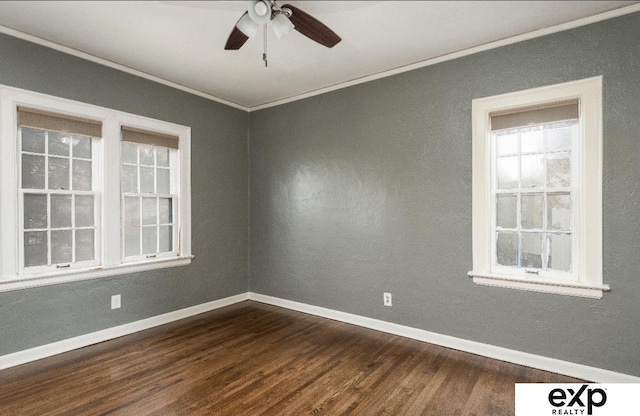 131 S 39th St Unit 6, Omaha, NE 68131 - empty room with dark wood-style floors, crown molding, ceiling fan, and baseboards