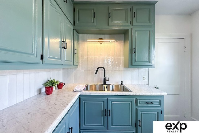 2626 N 67th St, Omaha, NE 68104 - kitchen with a sink, light countertops, and decorative backsplash