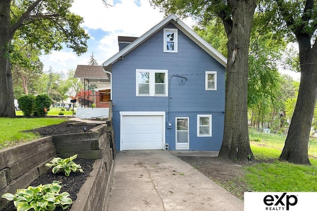 2626 N 67th St, Omaha, NE 68104 - view of front of house with a garage and driveway